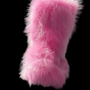 Women’s fuzzy, bright pink boots